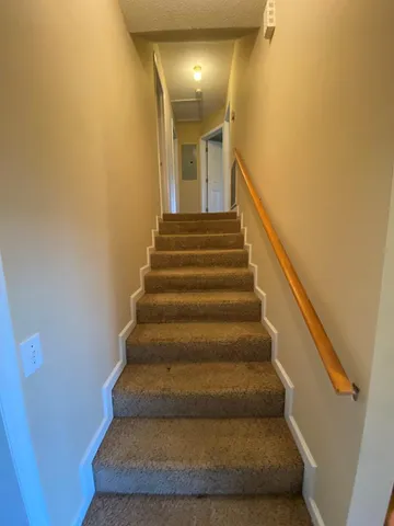 a view of an empty room with windows