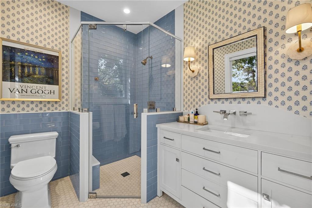 111 Caribbean Road Naples, FL 34108 - Photo 36 of 50 a bathroom with a sink toilet and shower