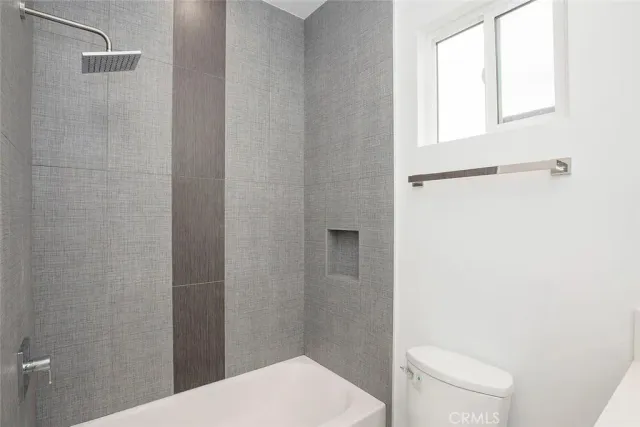 a bathroom with a toilet and a sink