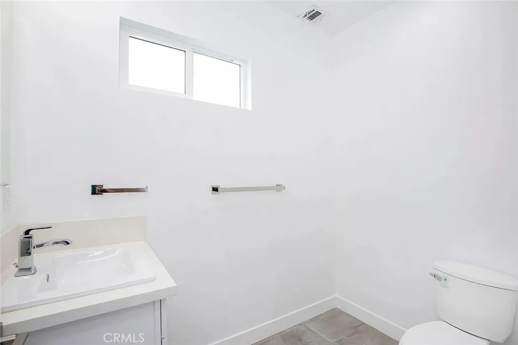 5026 Cleon Avenue North Hollywood, CA 91601 - Photo 19 of 19 a bathroom with a sink and a vanity