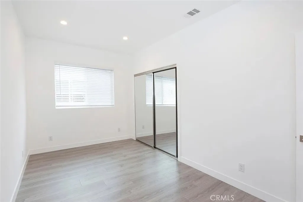 5026 Cleon Avenue North Hollywood, CA 91601 - Photo 9 of 19 an empty room with windows and closet
