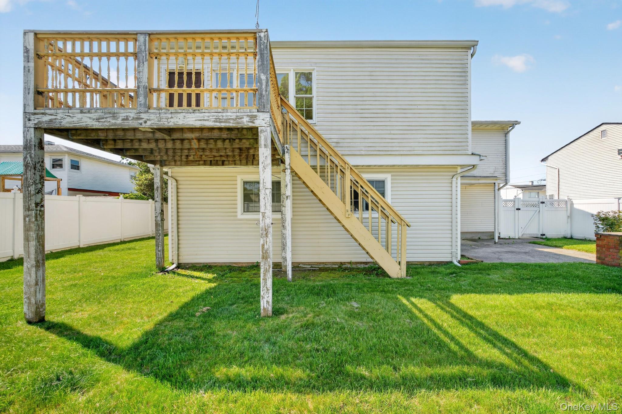138 Spring Street Massapequa, NY 11758 - Photo 44 of 45 a view of a house with a yard