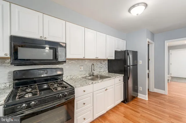 a kitchen with a stove and a microwave