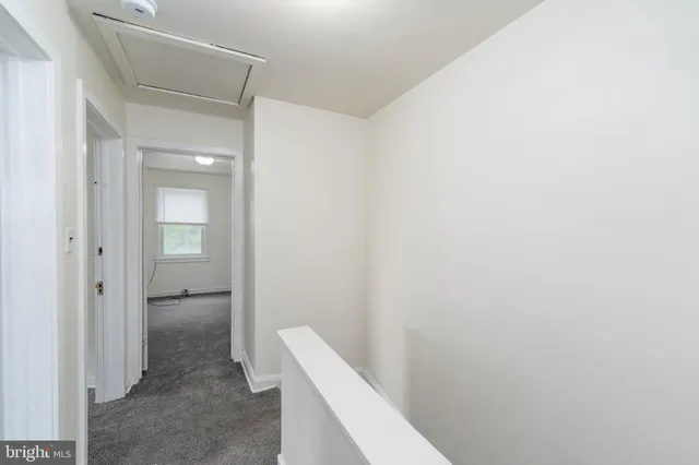 a bathroom with a sink toilet vanity and window