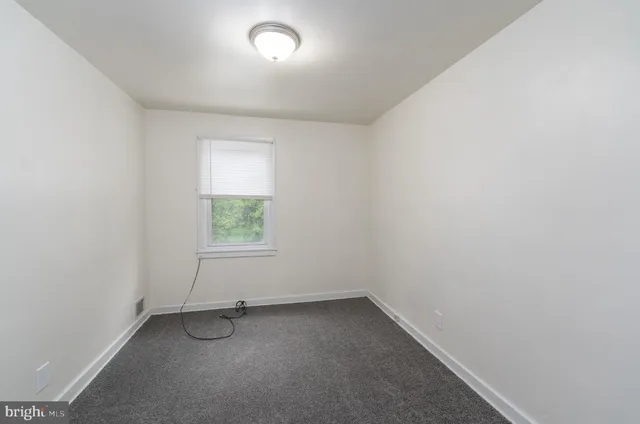 a bathroom with a sink toilet and mirror