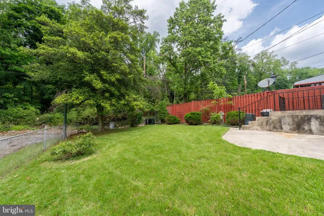 a view of a house with a backyard porch and sitting area
