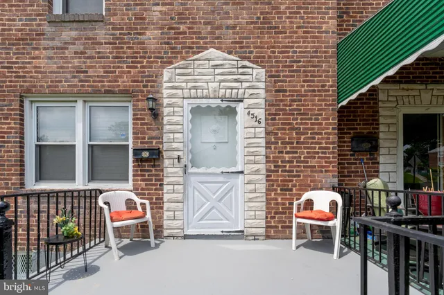 a front view of a house with glass windows