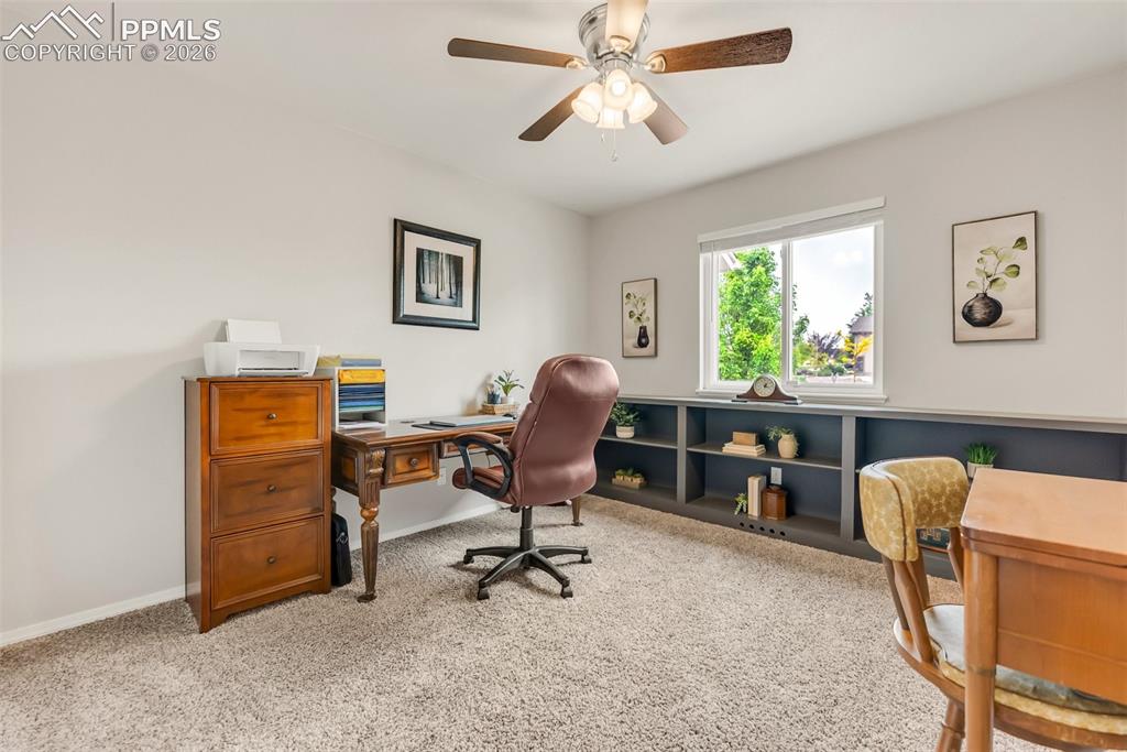 10467 Pictured Rocks Drive Peyton, CO 80831 - Photo 26 of 42 3rd Main level bedroom with built ins being used as an office