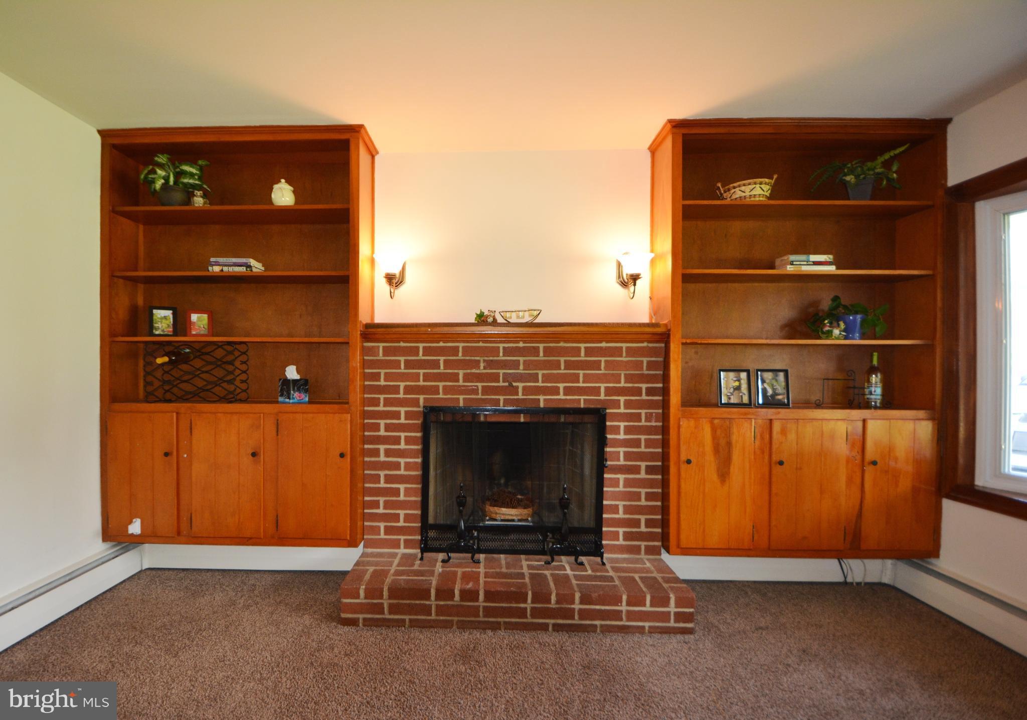 310 Hook Road Westminster, MD 21157 - Photo 25 of 30 Wood burning fireplace, built in bookcase cabinets