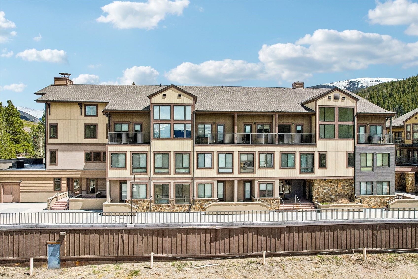 1211 West Keystone Road, Unit 2747 Keystone, CO 80435 - Photo 21 of 31 a front view of a residential apartment building with a bench