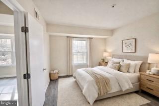 14905 Cleese Court, Unit E Silver Spring, MD 20906 - Photo 6 of 10 a bedroom with a bed and a window