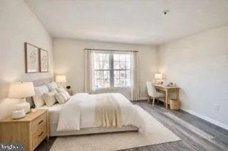 a bedroom with a bed and a table