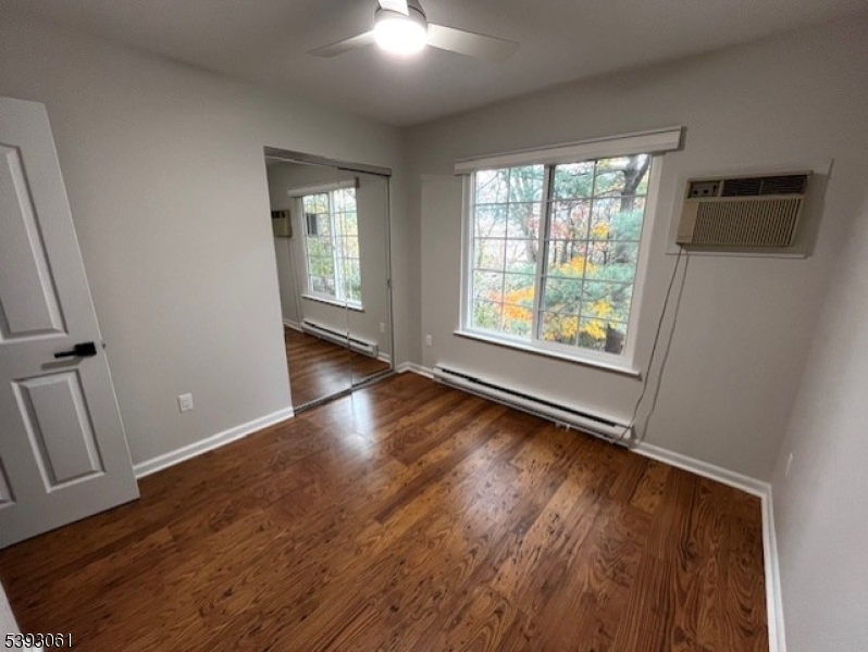 8 Larkspur Court Bedminster, NJ 07921 - Photo 13 of 19 an empty room with wooden floor and windows
