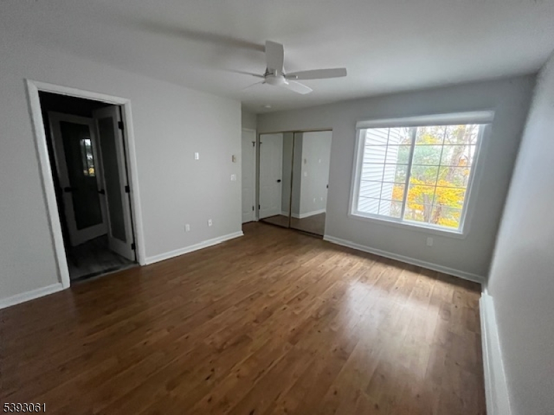 8 Larkspur Court Bedminster, NJ 07921 - Photo 10 of 19 an empty room with wooden floor and windows