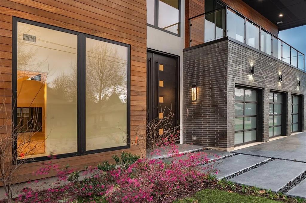 309 Kaye Street Coppell, TX 75019 - Photo 7 of 36 Modern exterior featuring wood-finish siding and dark brickwork