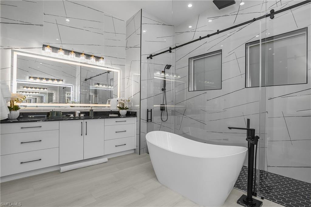 788 9th Street Southwest Naples, FL 34117 - Photo 11 of 46 a bathroom with a bathtub and a sink