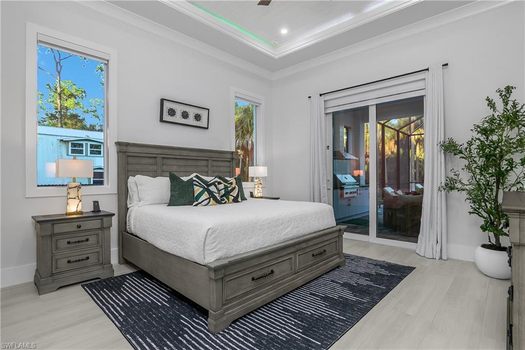 788 9th Street Southwest Naples, FL 34117 - Photo 13 of 46 a bedroom with a large bed and a dresser