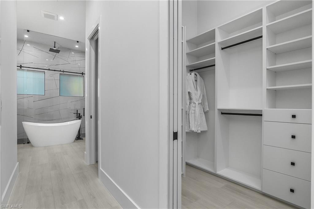 788 9th Street Southwest Naples, FL 34117 - Photo 14 of 46 a bathroom with a bathtub and shower
