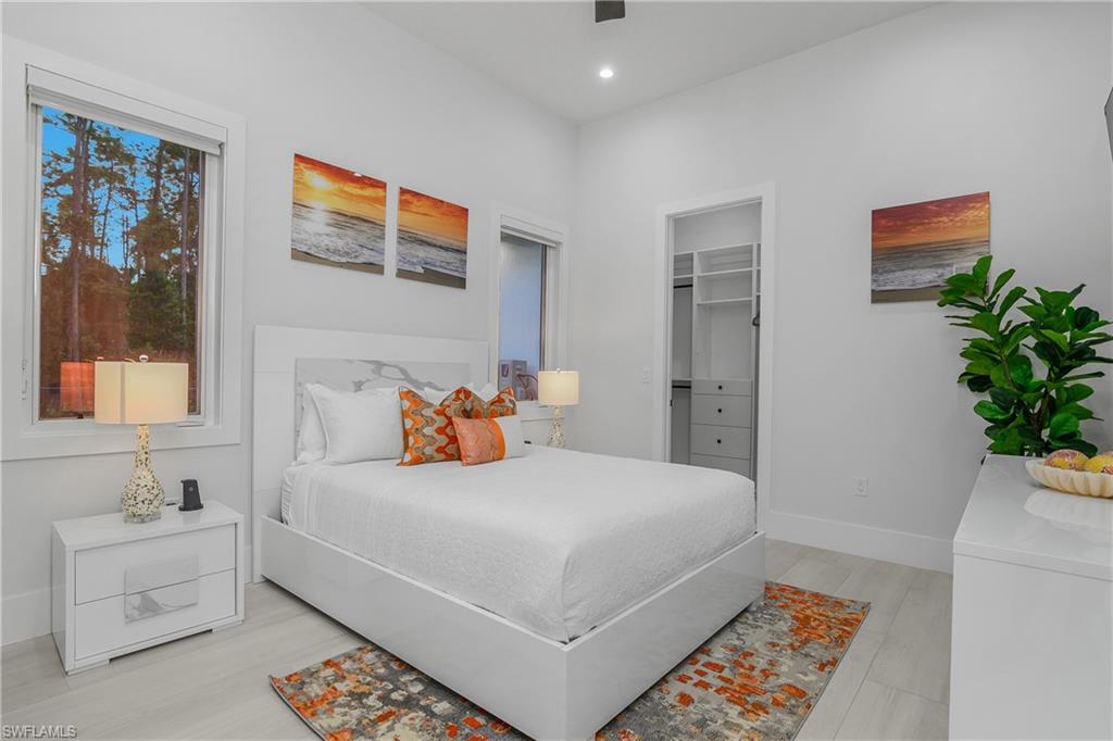 788 9th Street Southwest Naples, FL 34117 - Photo 17 of 46 a bedroom with a bed and a couch