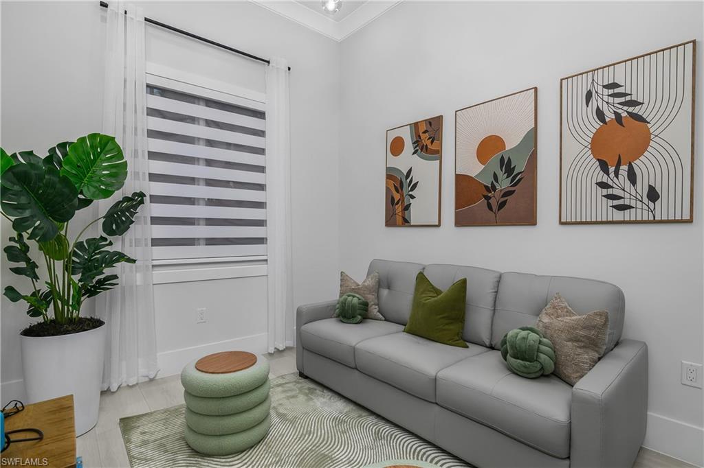 788 9th Street Southwest Naples, FL 34117 - Photo 21 of 46 a living room with furniture and a potted plant