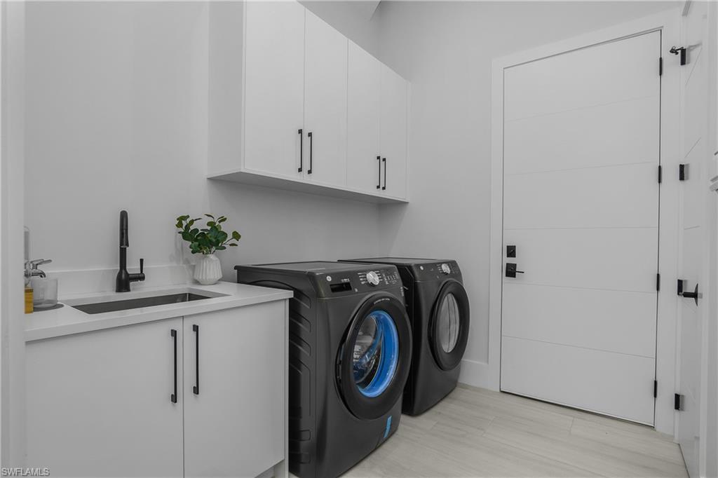 788 9th Street Southwest Naples, FL 34117 - Photo 22 of 46 a utility room with sink dryer and washer