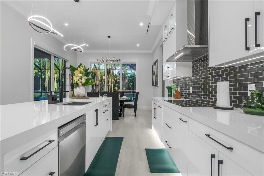 788 9th Street Southwest Naples, FL 34117 - Photo 23 of 46 a large white kitchen with a large window