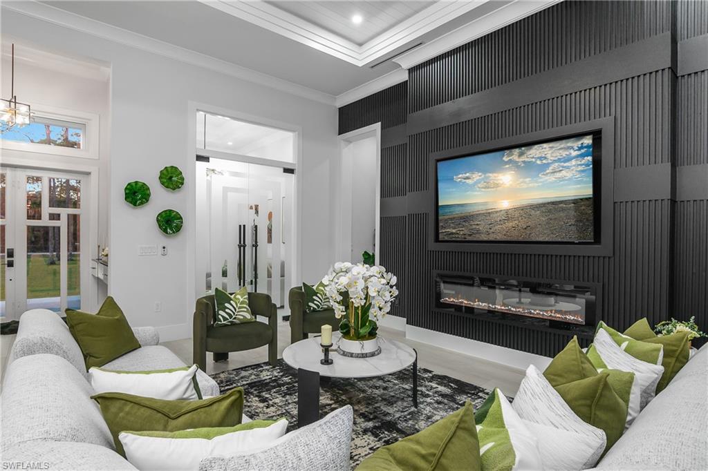 788 9th Street Southwest Naples, FL 34117 - Photo 29 of 46 a living room with furniture and a flat screen tv