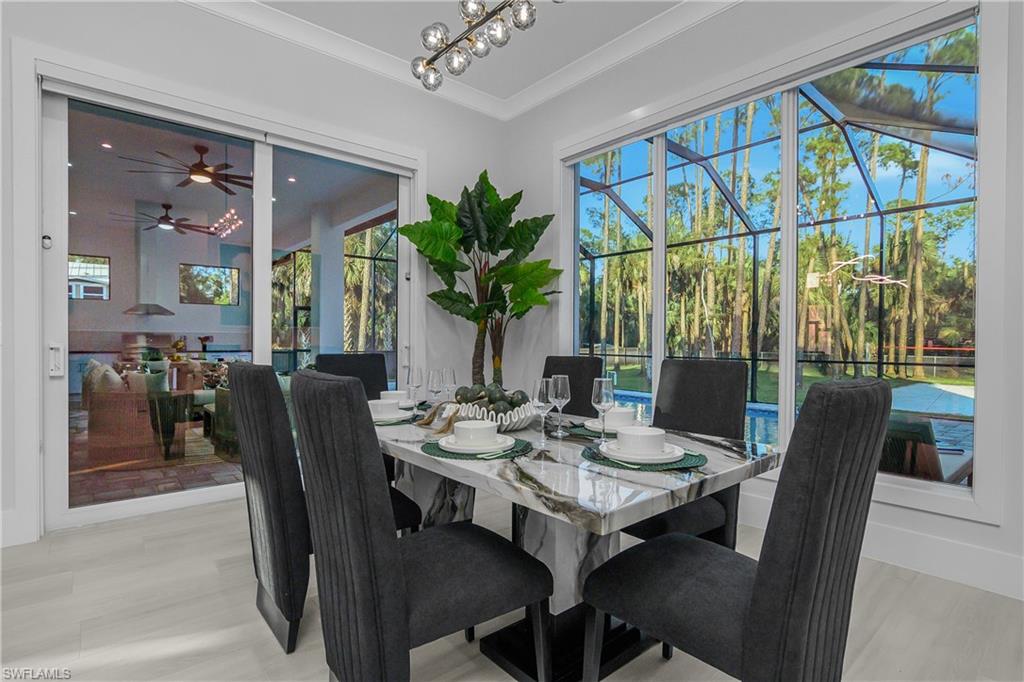 788 9th Street Southwest Naples, FL 34117 - Photo 32 of 46 a view of a dining room with furniture window and outside view