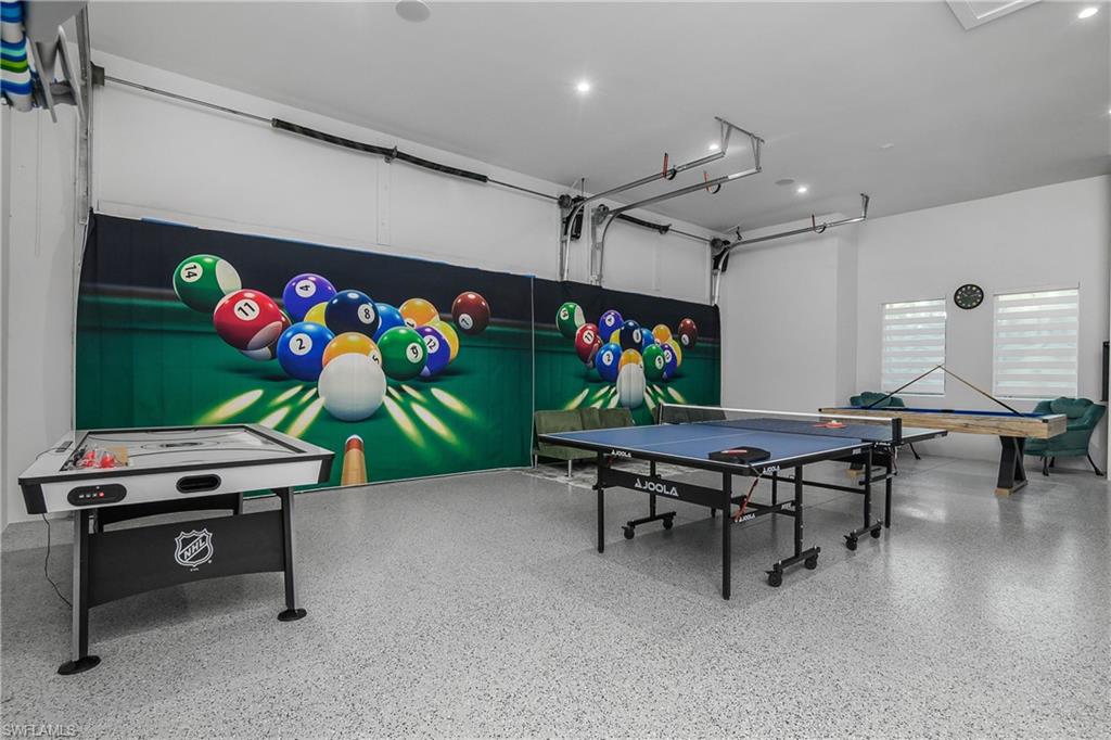 788 9th Street Southwest Naples, FL 34117 - Photo 33 of 46 a living room with furniture and a flat screen tv