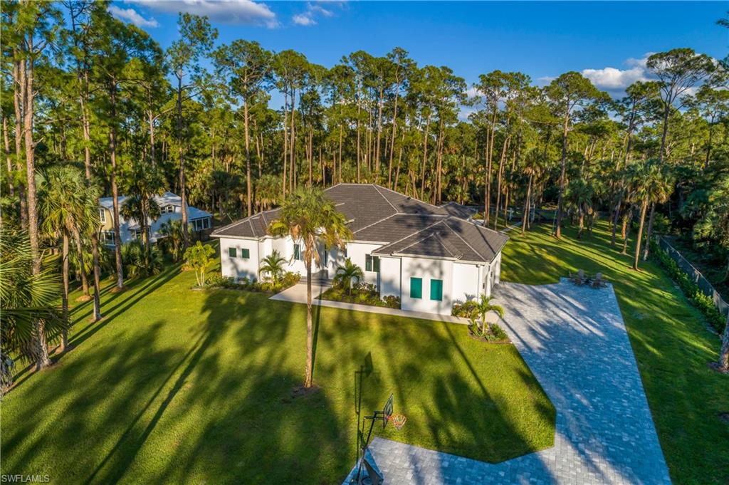 788 9th Street Southwest Naples, FL 34117 - Photo 38 of 46 a view of a house with a yard