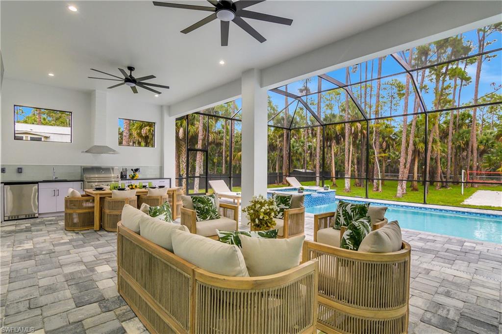 788 9th Street Southwest Naples, FL 34117 - Photo 41 of 46 a living room with furniture and a large window