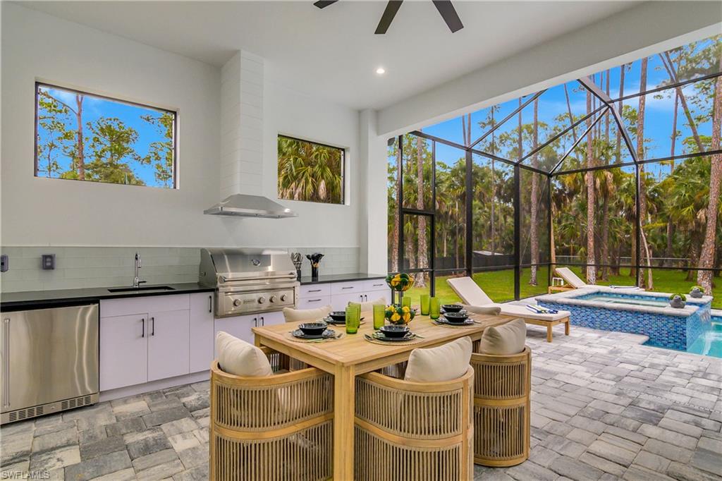 788 9th Street Southwest Naples, FL 34117 - Photo 42 of 46 a view of a dining room with furniture a chandelier and wooden floor