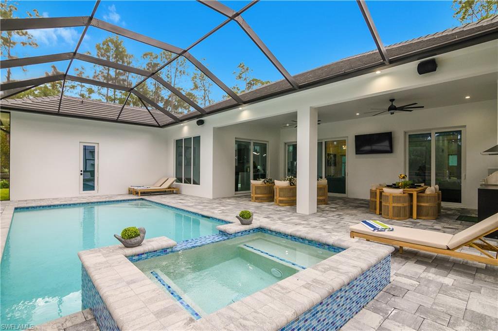 788 9th Street Southwest Naples, FL 34117 - Photo 44 of 46 a view of a patio with a table and chairs