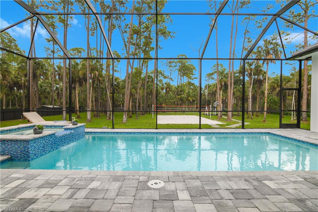788 9th Street Southwest Naples, FL 34117 - Photo 45 of 46 a view of swimming pool with a yard