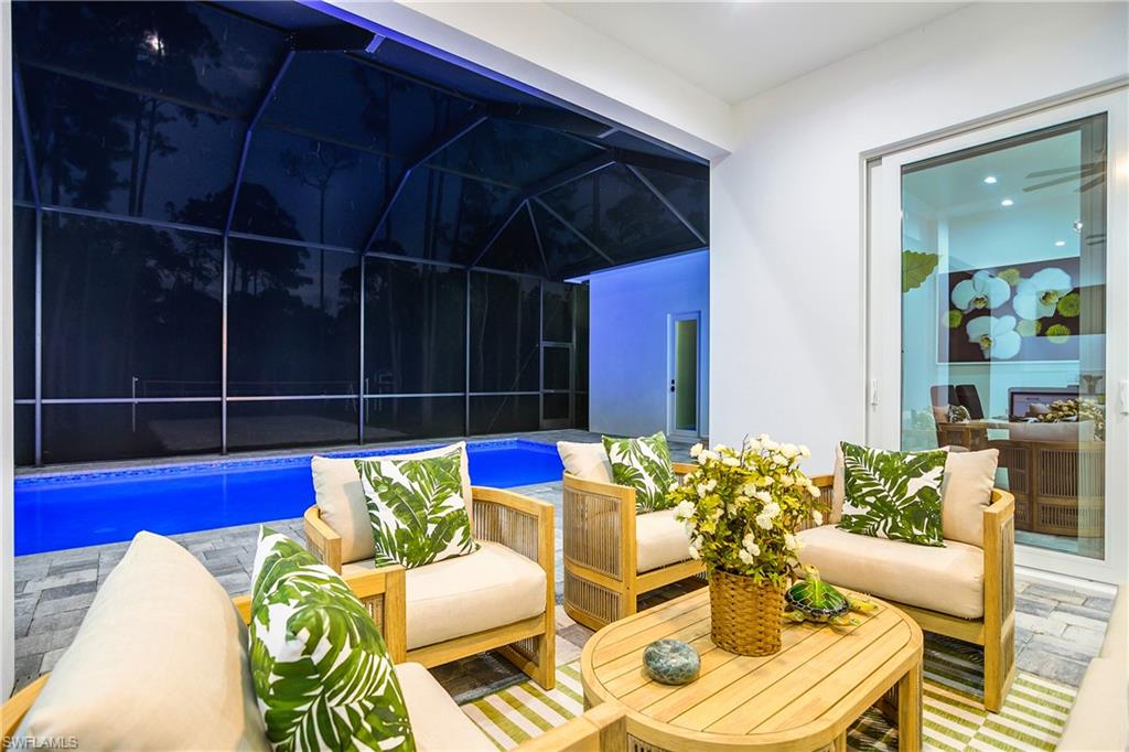 788 9th Street Southwest Naples, FL 34117 - Photo 7 of 46 a view of a dining room with furniture and wooden floor