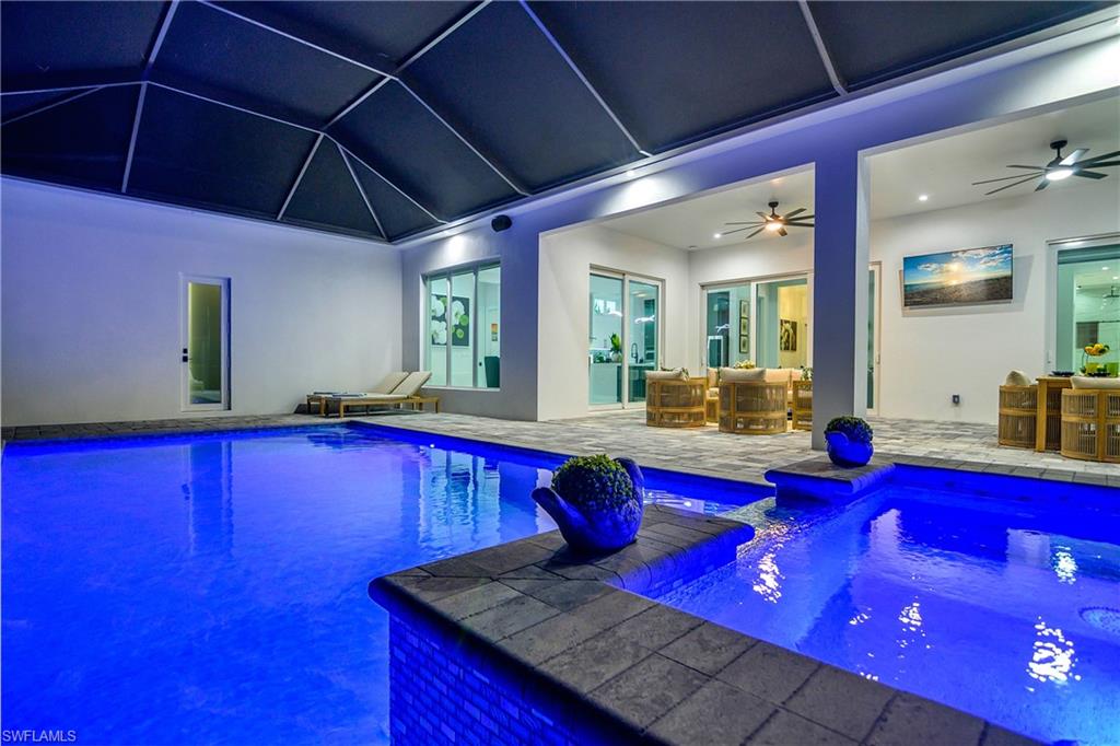 788 9th Street Southwest Naples, FL 34117 - Photo 8 of 46 a kitchen with stainless steel appliances granite countertop wooden cabinets and table