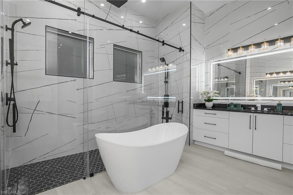 788 9th Street Southwest Naples, FL 34117 - Photo 10 of 46 a bathroom with a bathtub and a shower