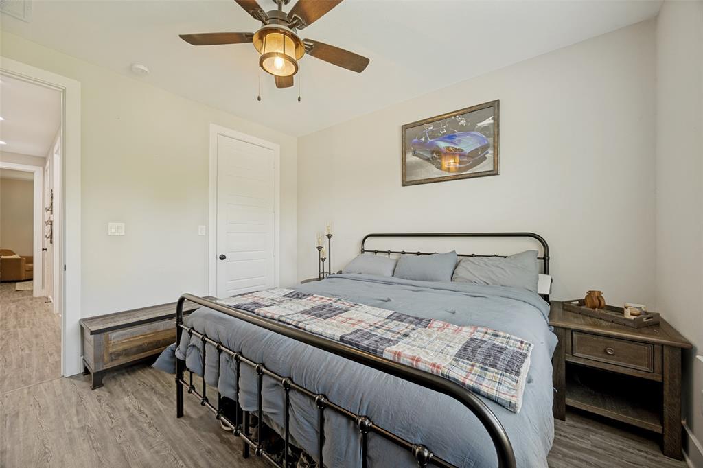1105 Ranch Drive Bonham, TX 75418 - Photo 17 of 25 Spacious bedroom featuring light-toned walls and wood-finish flooring