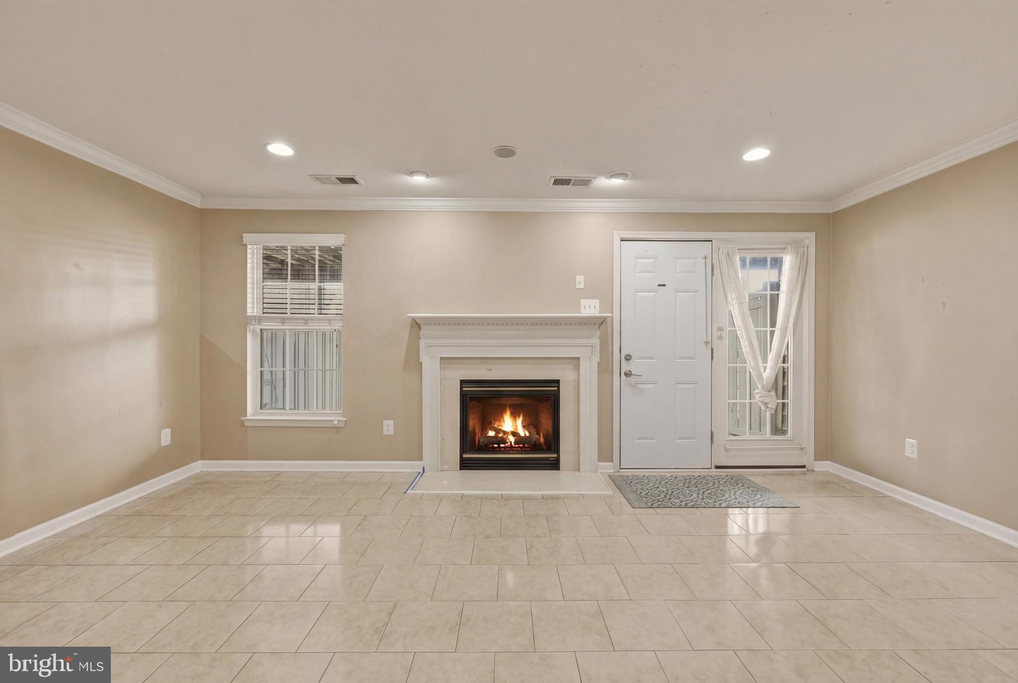 148 Riparian Lane Ranson, WV 25438 - Photo 37 of 41 Cozy living space with inviting fireplace.