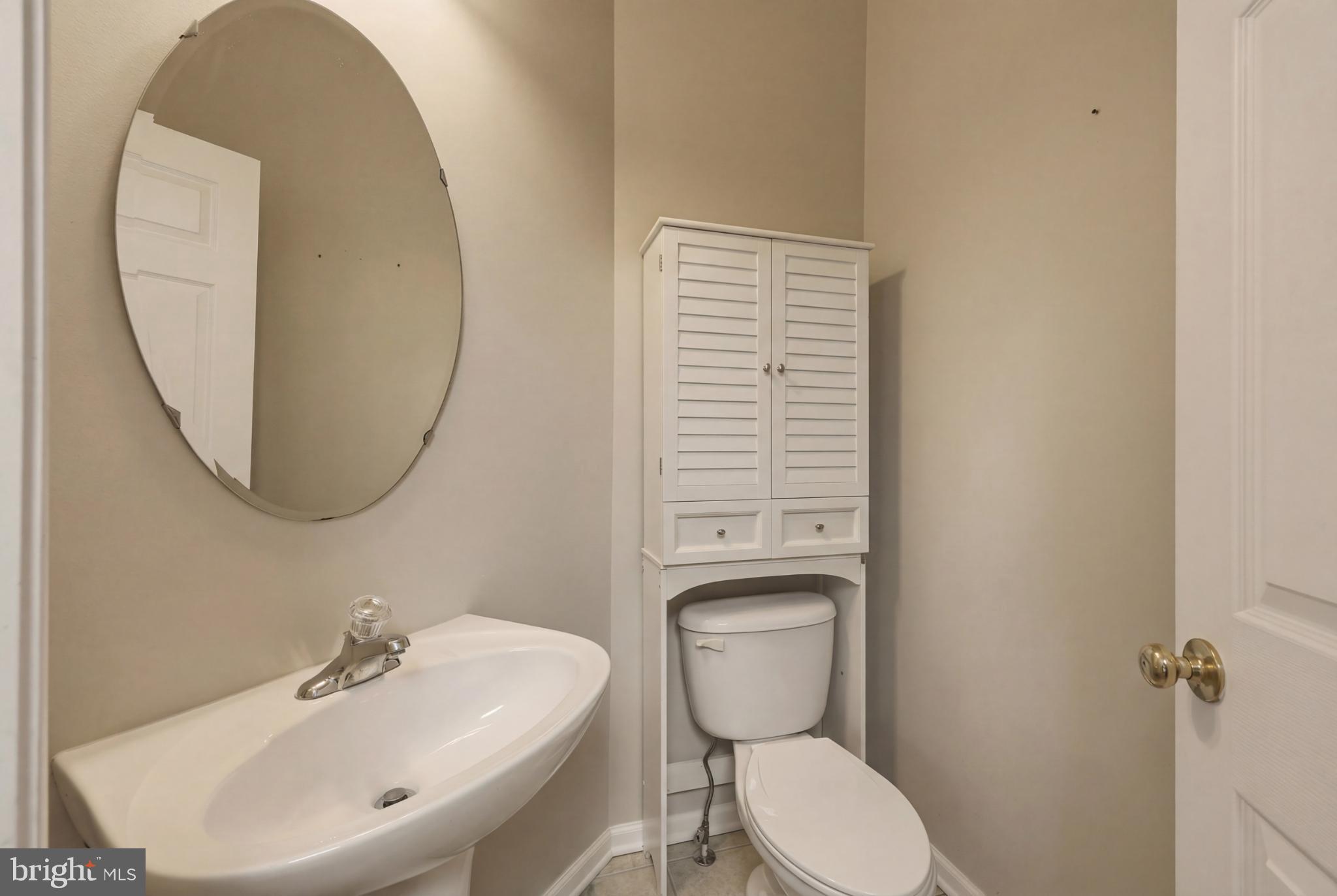 148 Riparian Lane Ranson, WV 25438 - Photo 8 of 41 Charming half-bath with modern touches.