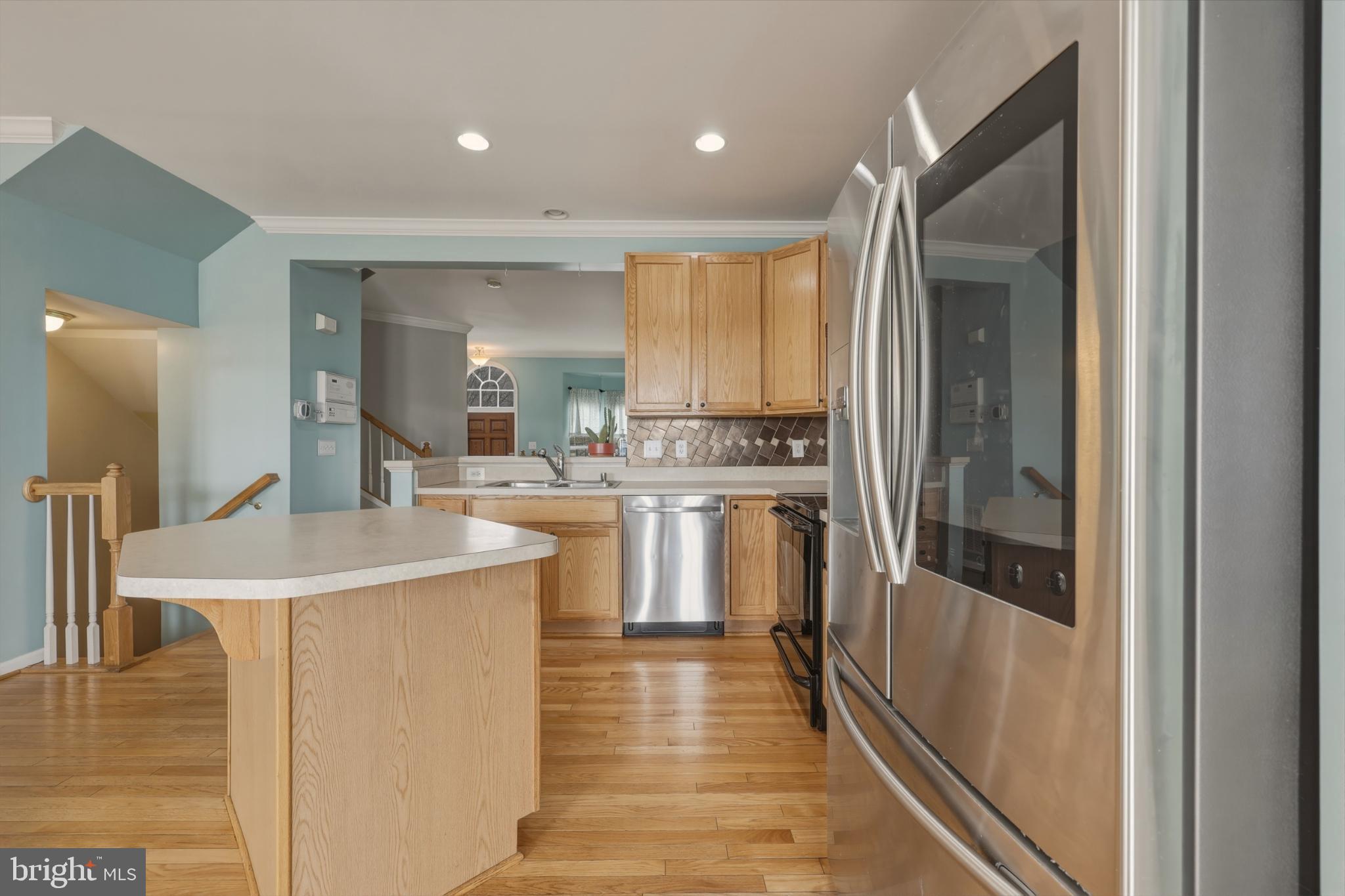 148 Riparian Lane Ranson, WV 25438 - Photo 10 of 41 Bright and inviting kitchen with modern finishes.