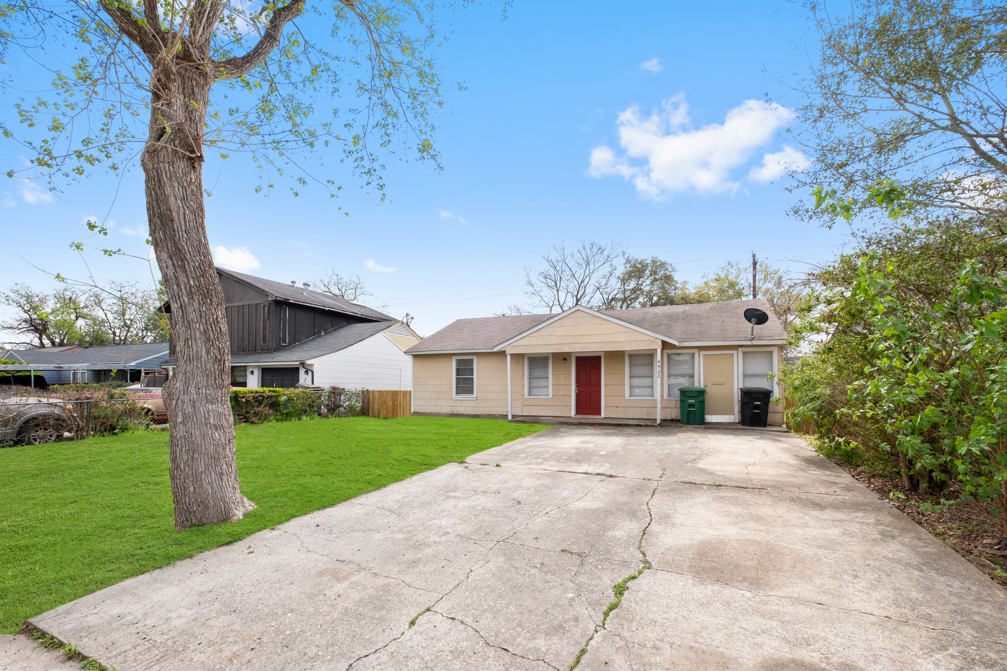 front view of a house with a yard