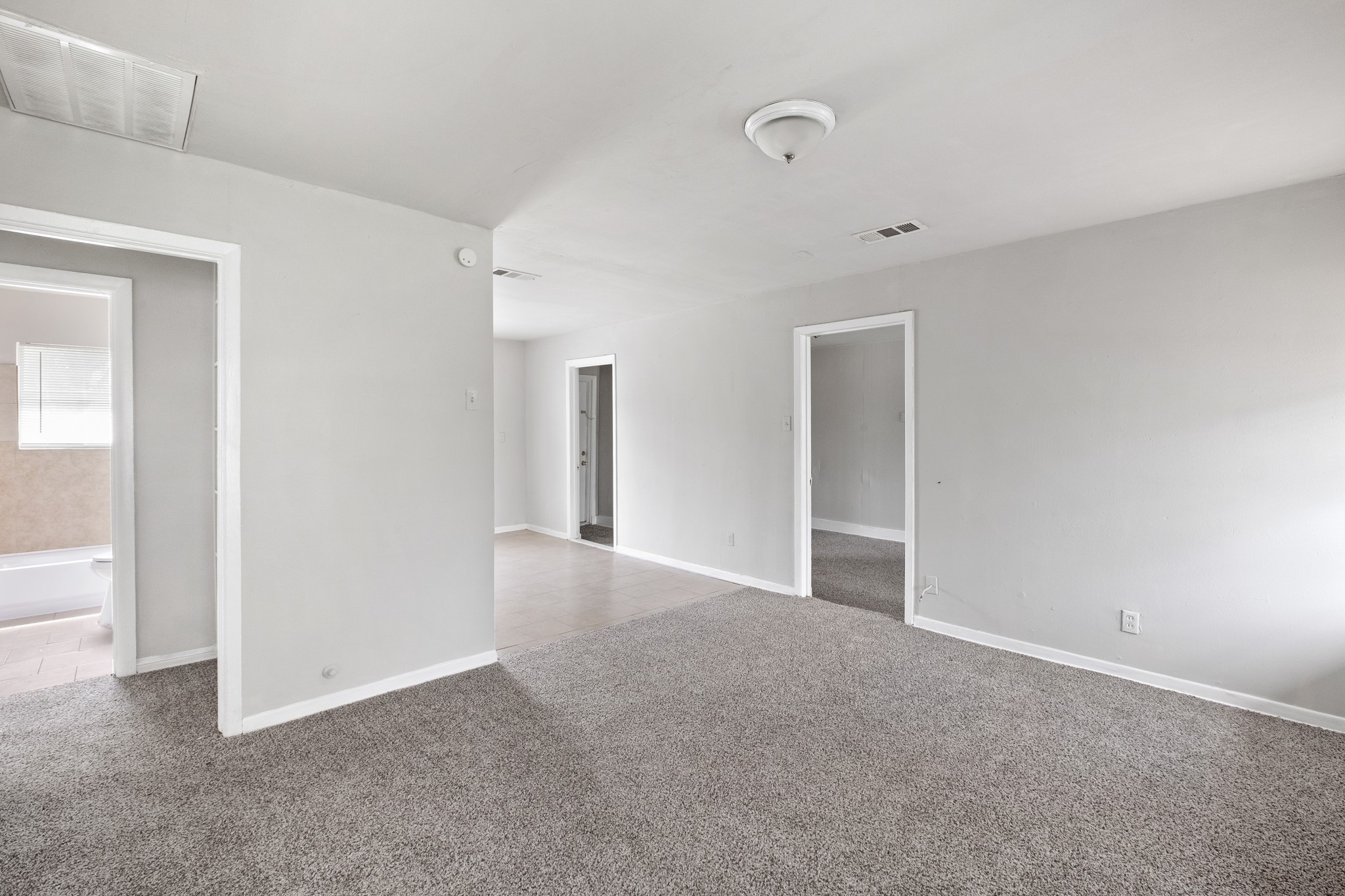 4922 Alvin Street Houston, TX 77033 - Photo 2 of 10 a view of an empty room with a window