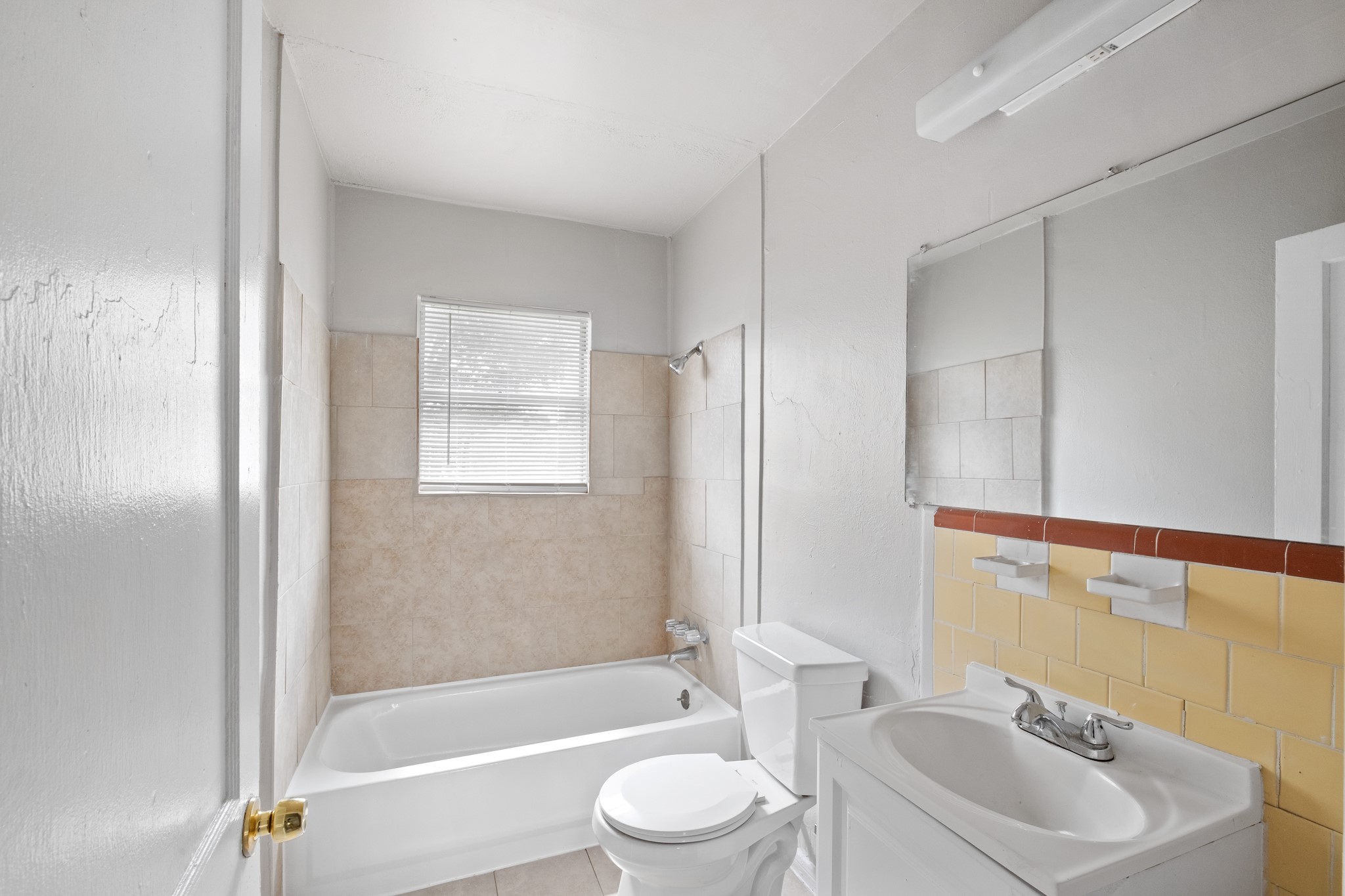 4922 Alvin Street Houston, TX 77033 - Photo 5 of 10 a bathroom with a sink toilet and bathtub