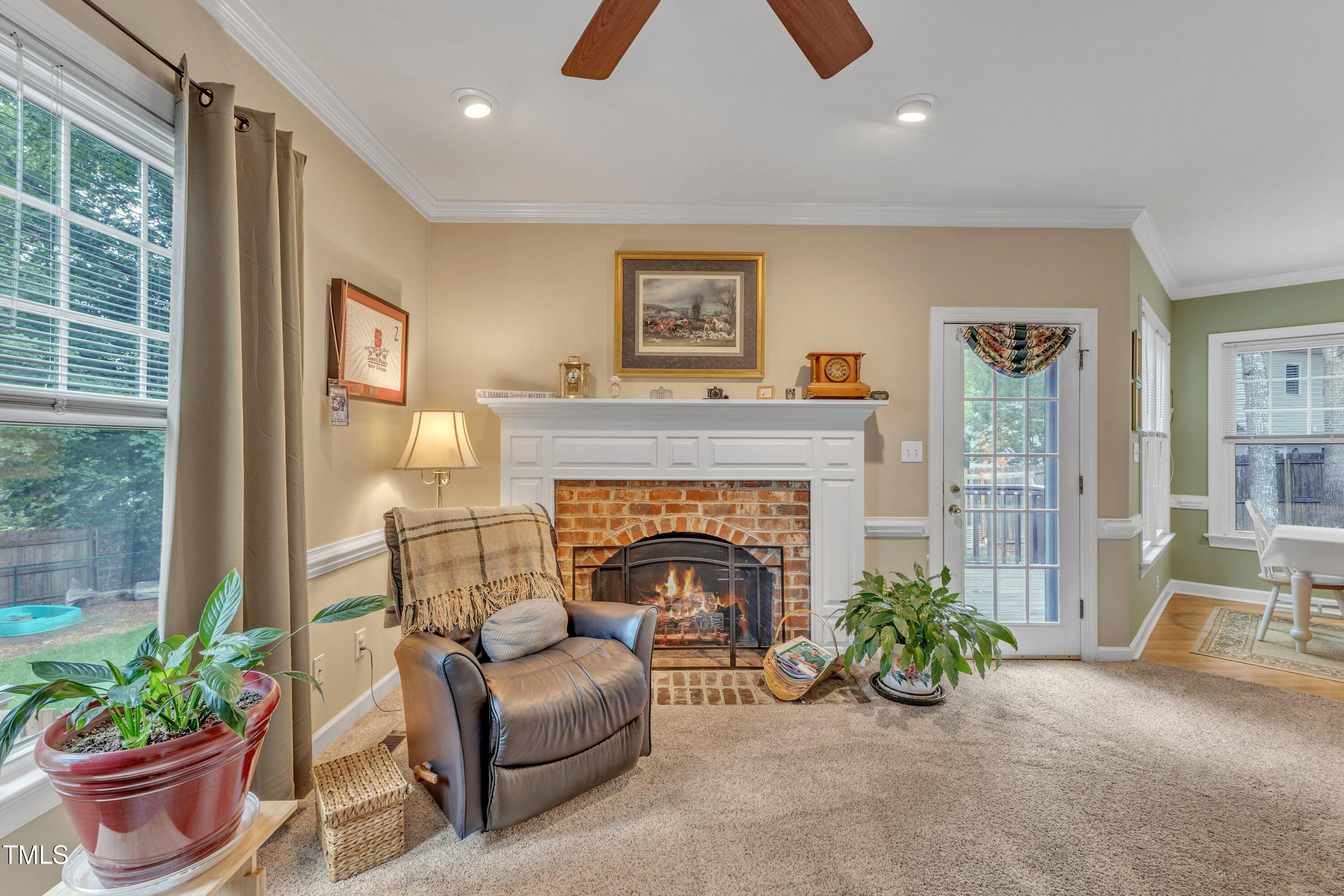 7613 Percy Court Raleigh, NC 27613 - Photo 16 of 51 a living room with furniture and a fireplace