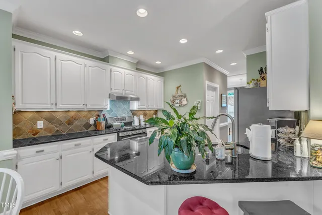 a kitchen with counter top space cabinets and stainless steel appliances