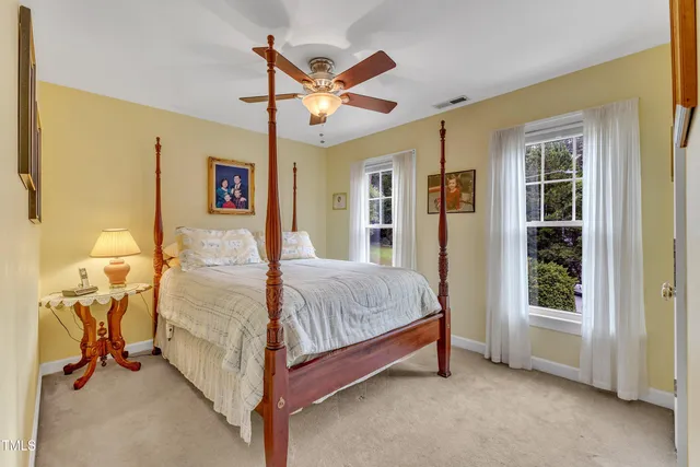 a bed room with a bed and a window