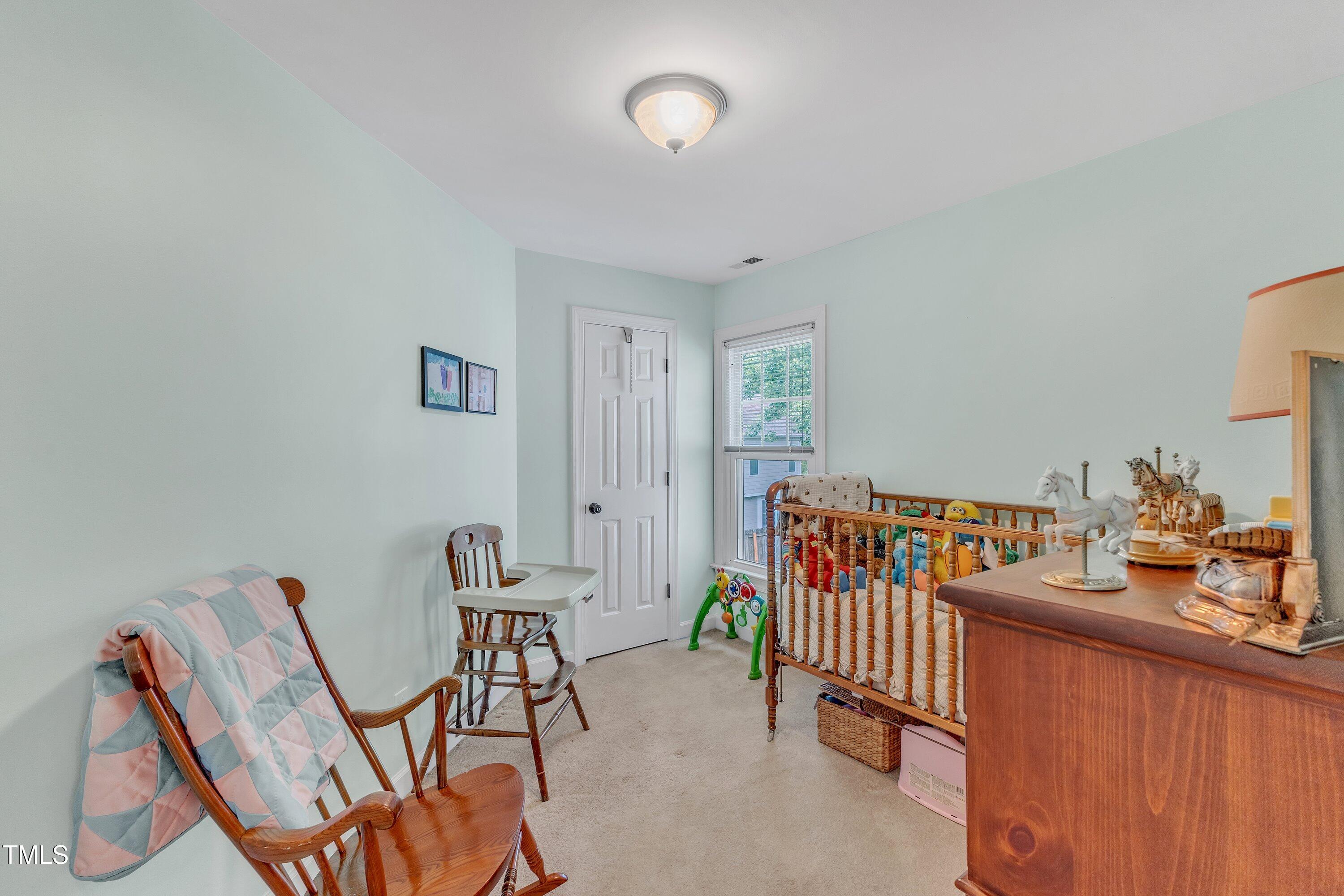 7613 Percy Court Raleigh, NC 27613 - Photo 37 of 51 a bedroom with furniture and a book shelf