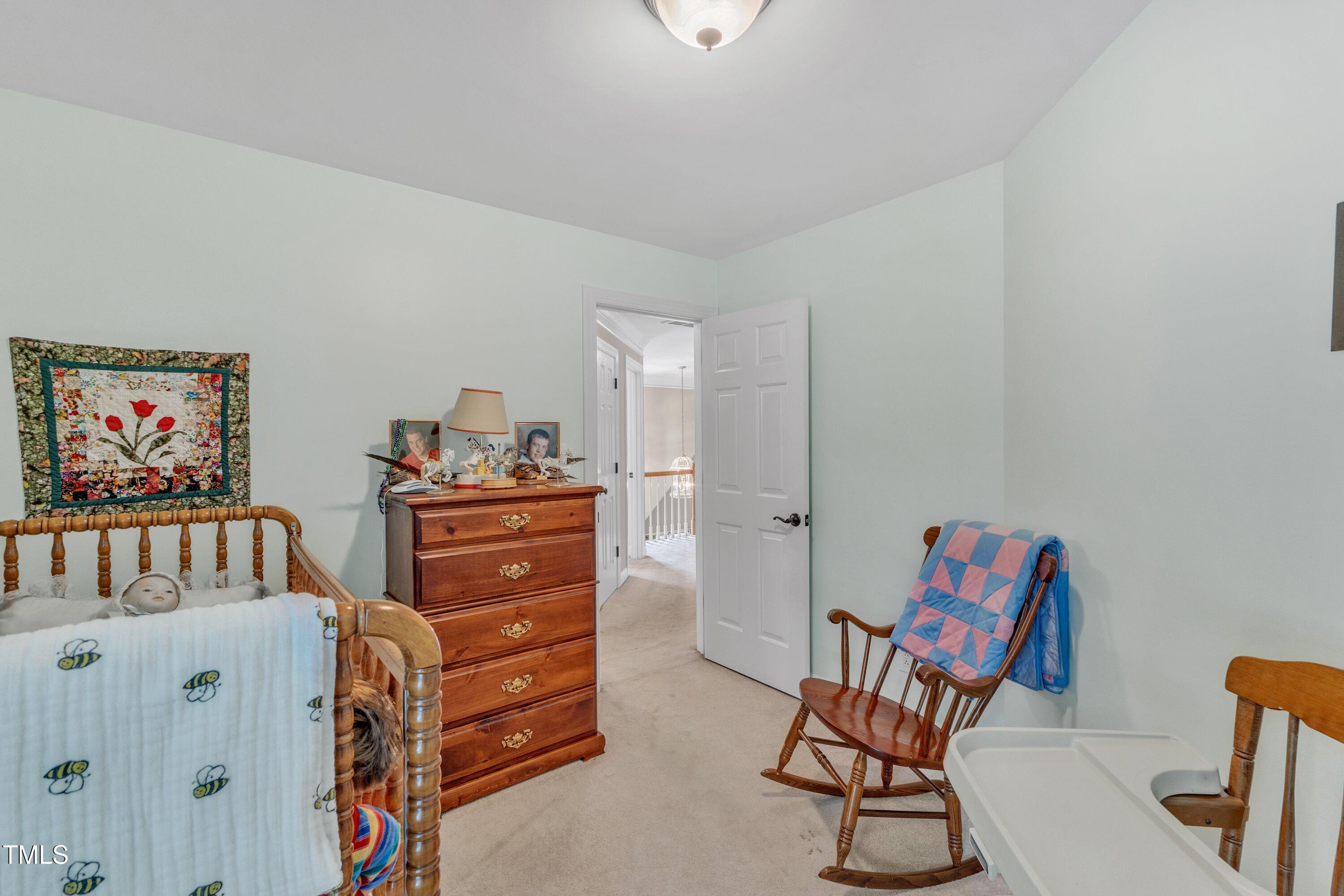 7613 Percy Court Raleigh, NC 27613 - Photo 38 of 51 a bedroom with furniture and a dresser