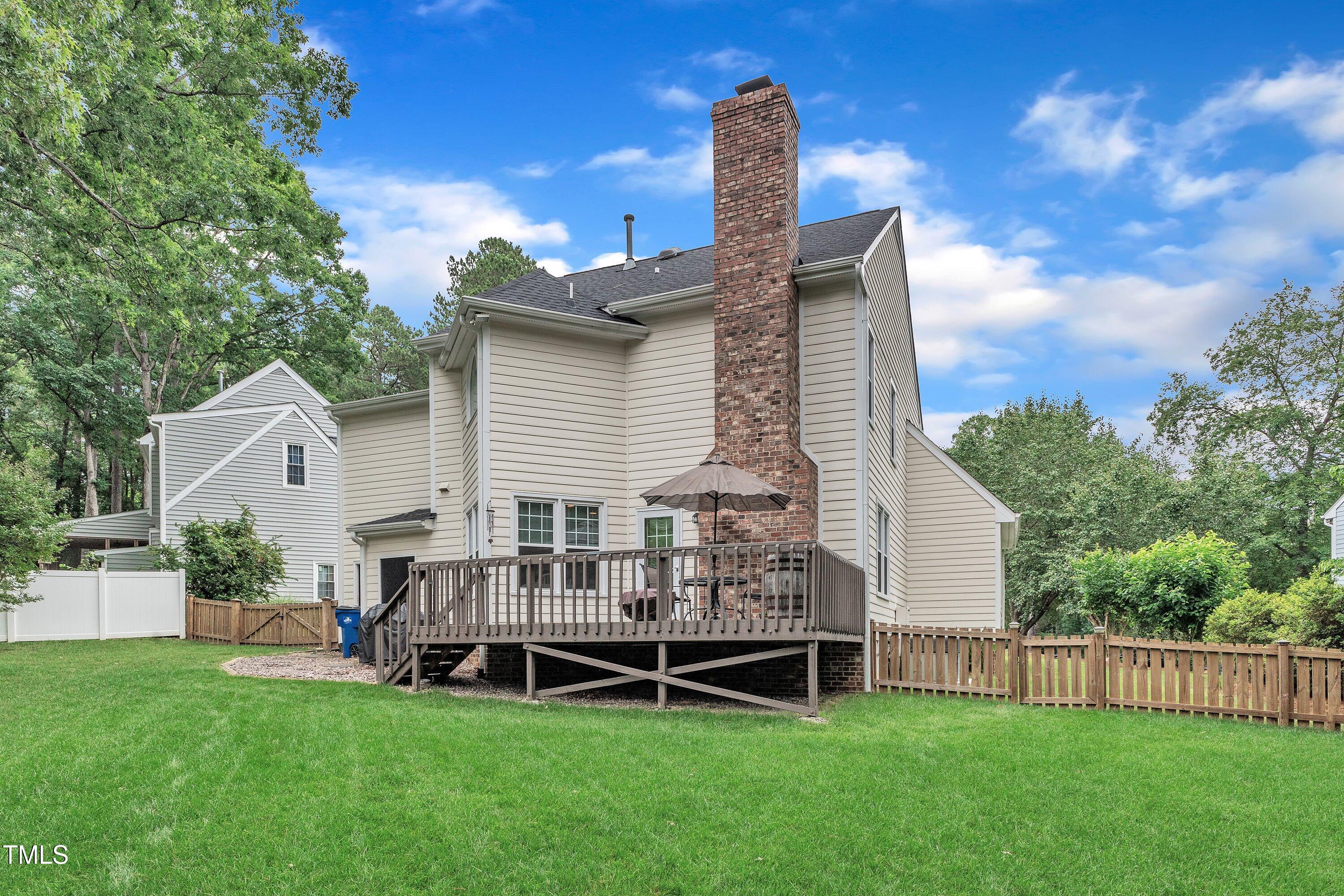 7613 Percy Court Raleigh, NC 27613 - Photo 45 of 51 a view of a house with a yard and sitting area